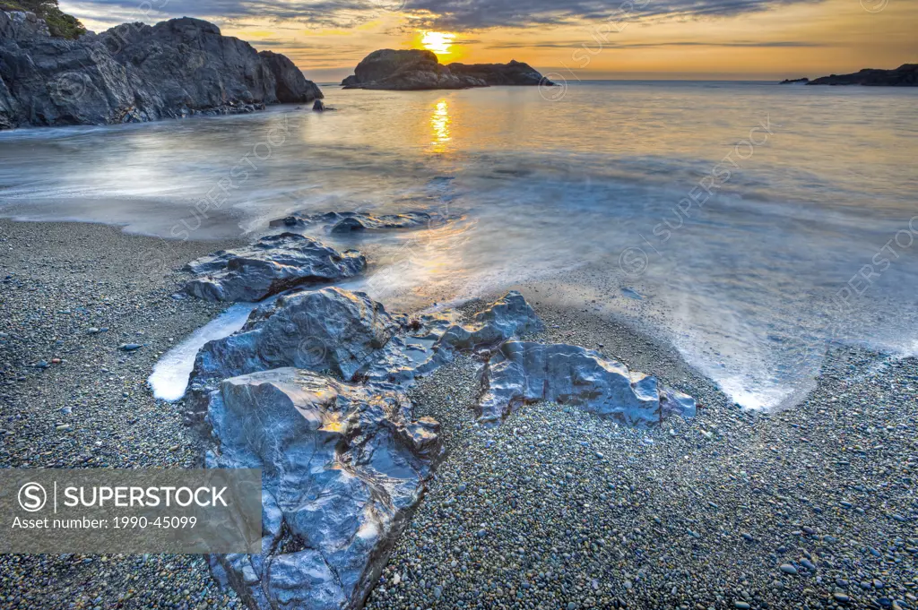 Water swirling around rocks along South Beach during sunset, Pacific Rim National Park, Long Beach Unit, Clayoquot Sound UNESCO Biosphere Reserve, Wes...