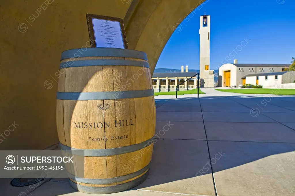 Wine barrel and sign at the entrance to Mission Hill Family Estate Winery, Westbank, West Kelowna, Kelowna, Okanagan, British Columbia, Canada.
