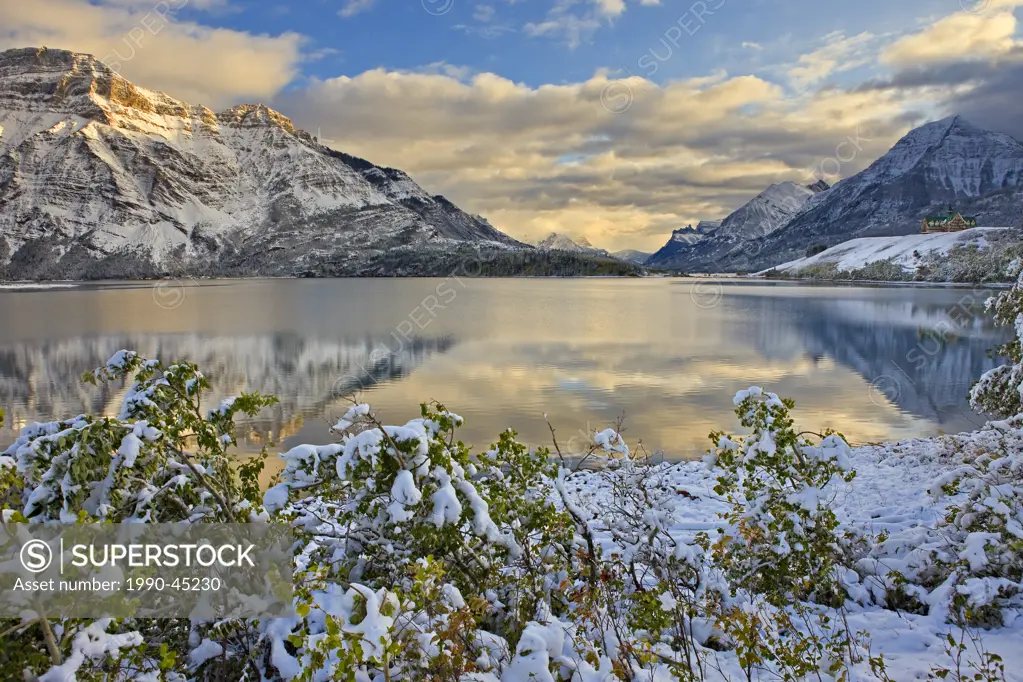 Prince of Wales Hotel opposite Mt Vimy and overlooking Middle Waterton Lake after the first snowfall of winter, Waterton Lakes National Park, Alberta,...