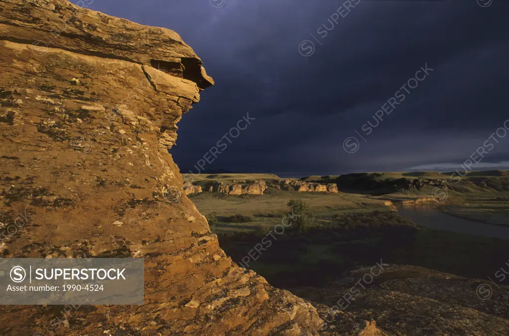 Hoodoo and storm clouds, Writing on Stone Provincial Park, Alberta, Canada
