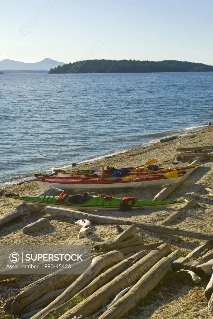 Kayaks on the beach at Blackberry Point on Valdes Island, Northern Gulf Islands, British Columbia, Canada