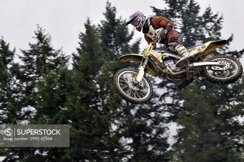 Motocross rider 28 is airborne during a jump at the Wastelands track in Nanaimo, British Columbia, Canada.