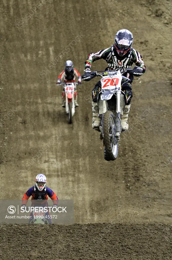 Motocross rider 20 gets airborne during a jump as he tries to stay ahead of his fellow racers at the Wastelands track in Nanaimo, British Columbia, Ca...