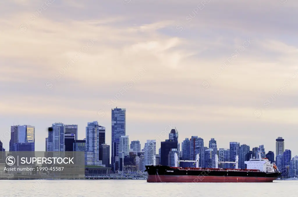 The freighter, Porthos, pulls up to the docks in Burrard Inlet in Vancouver, British Columbia, Canada