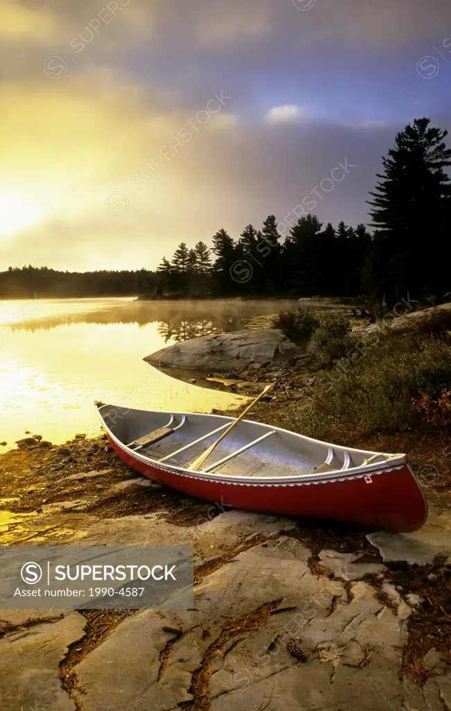 A canoe rests on the shores of Killarney Provincial Park, Ontario, Canada
