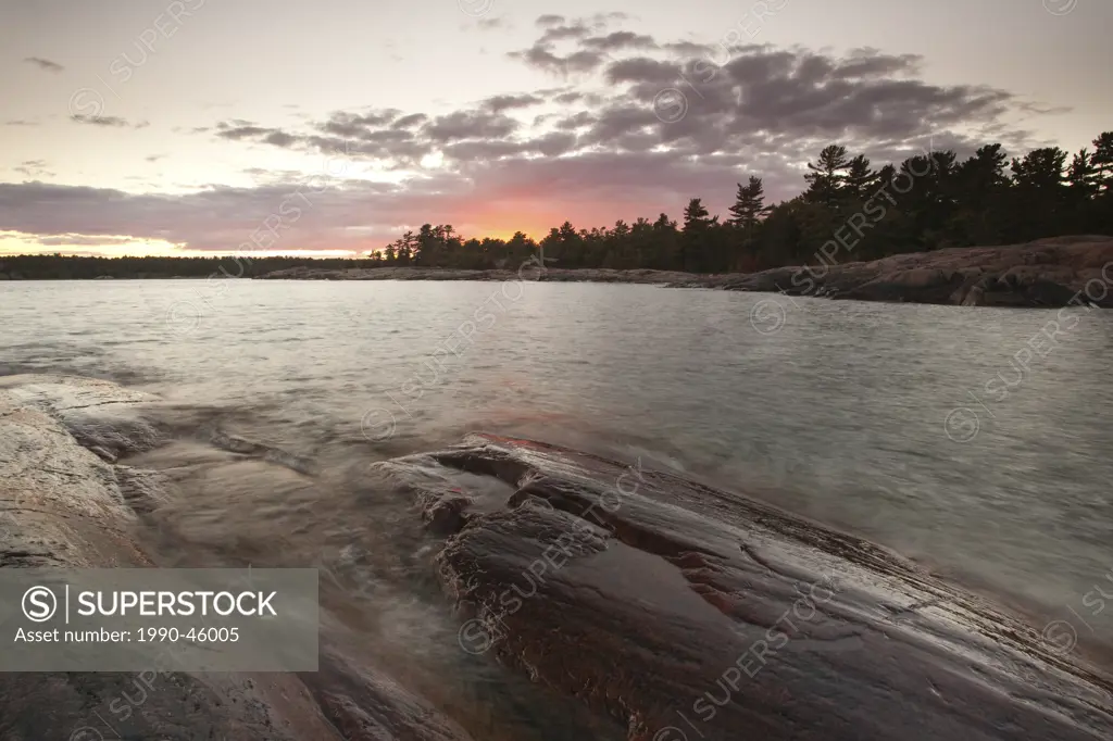 Sunset on shore of Georgian Bay at Killarney Provincial Park, Ontario, Canada.