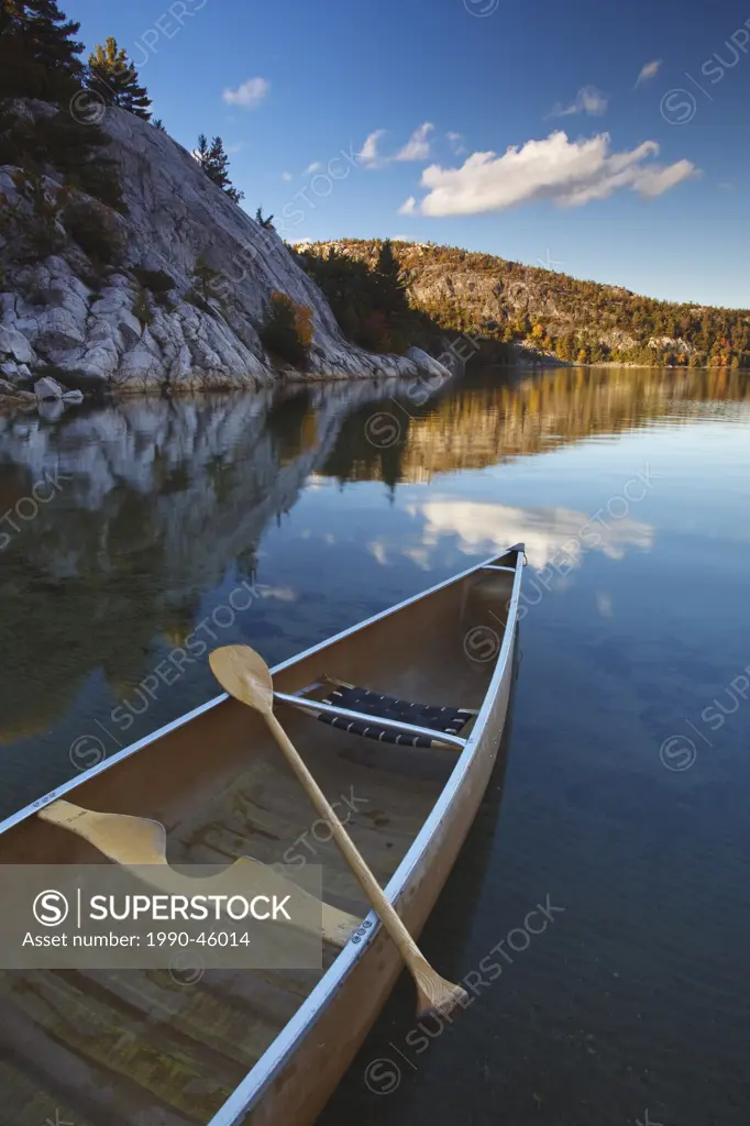 Sunset, Canoe on George Lake in Killarney Provincial Park, Ontario, Canada.