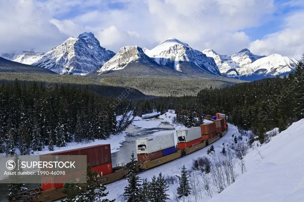 Train at Morant´s curve with Haddo Peak, Saddle Mountain, Fairview Mountain in the background, Banff National Park, Alberta, Canada