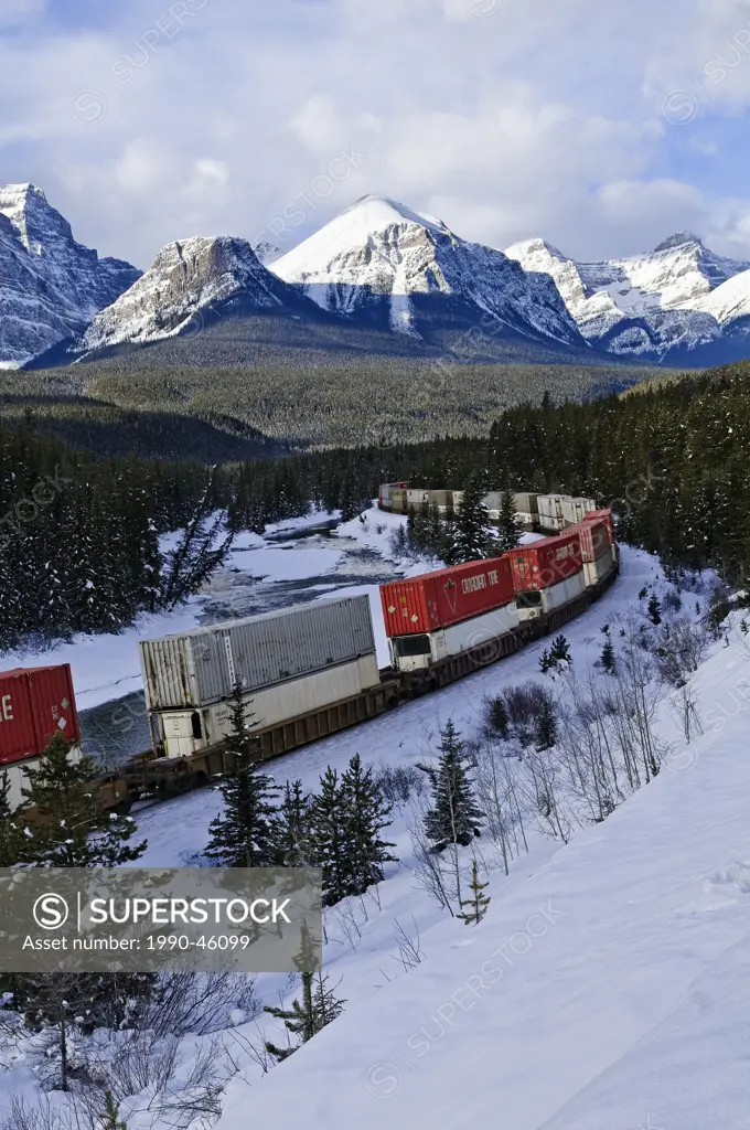 Train at Morant´s curve with Haddo Peak, Saddle Mountain, Fairview Mountain in the background, Banff National Park, Alberta, Canada