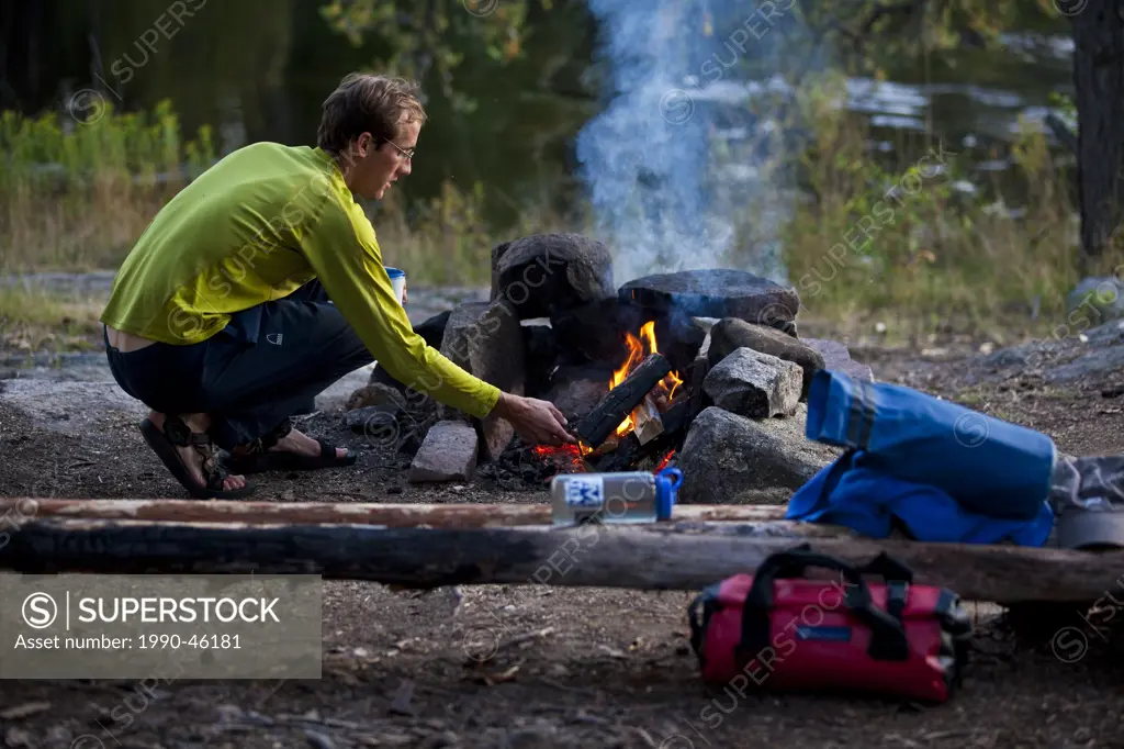 A young man canoeing and camping for 2 weeks in Wabakimi Provincial Park, Northern Ontario, Canada