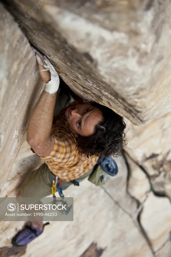 A male climber jams, Karate Crack 5.9, Red Rocks, Nevada, United States of America