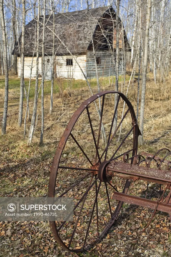 Abandoned plow and log barn, on the Kudlowich Homestead. Birds Hill Provincial Park, Manitoba, Canada.