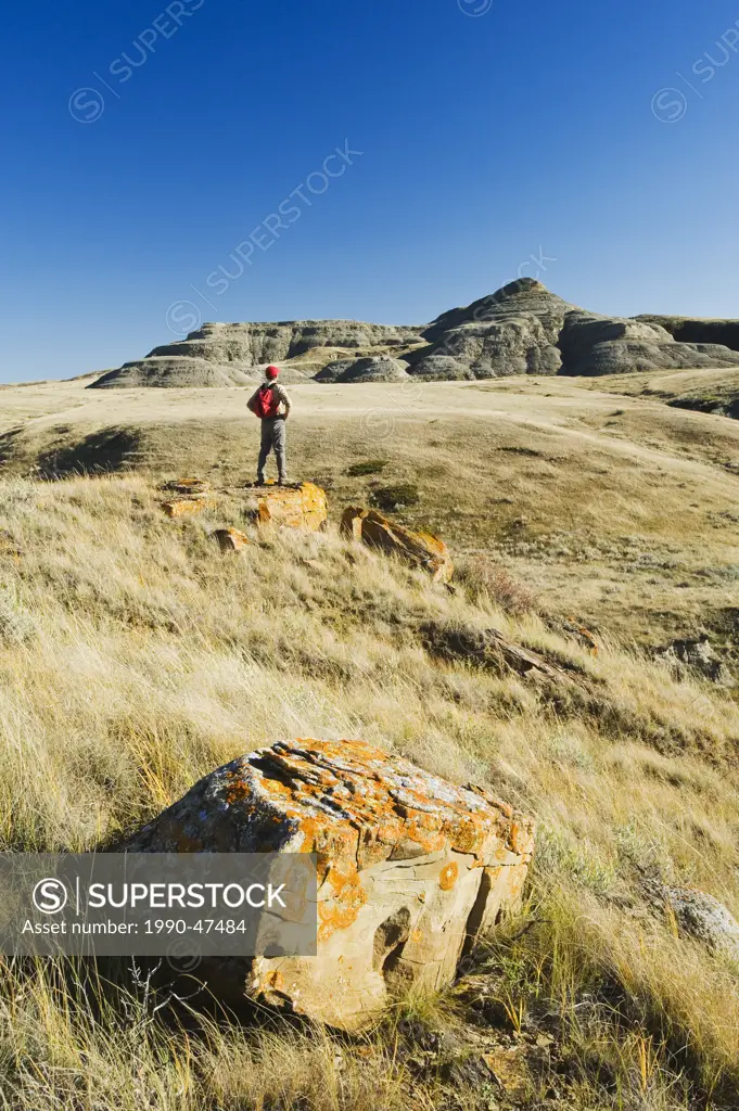 Hiker in the Killdeer Badlands, East Block, Grasslands National Park, Saskatchewan, Canada