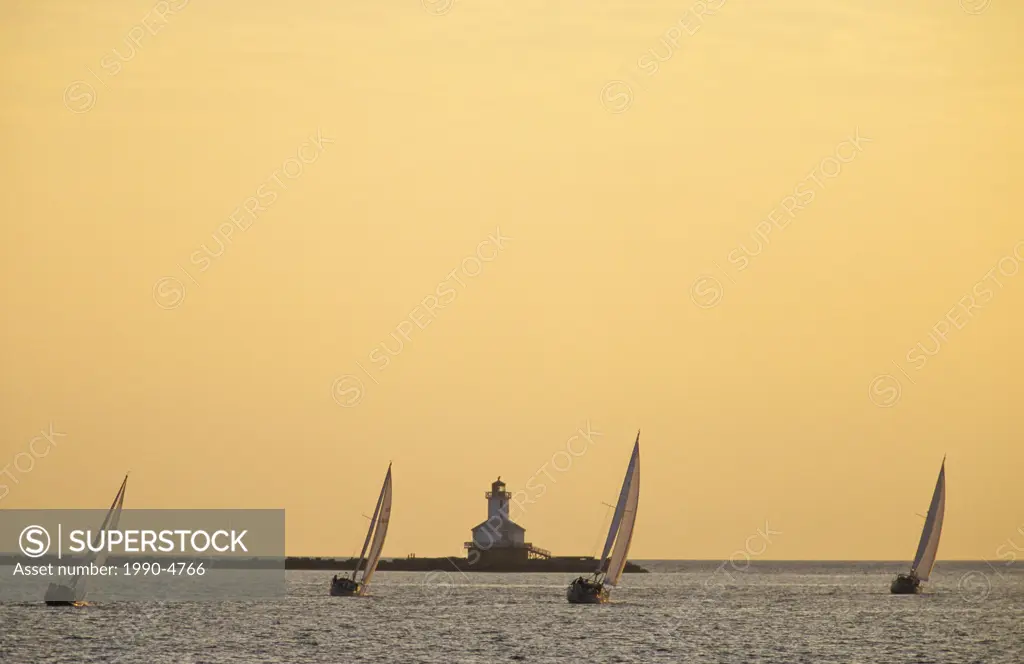 Sailboats racing near Schurman´s Point with Indian Head Lighthouse in background, Summerside, Prince Edward Island, Canada