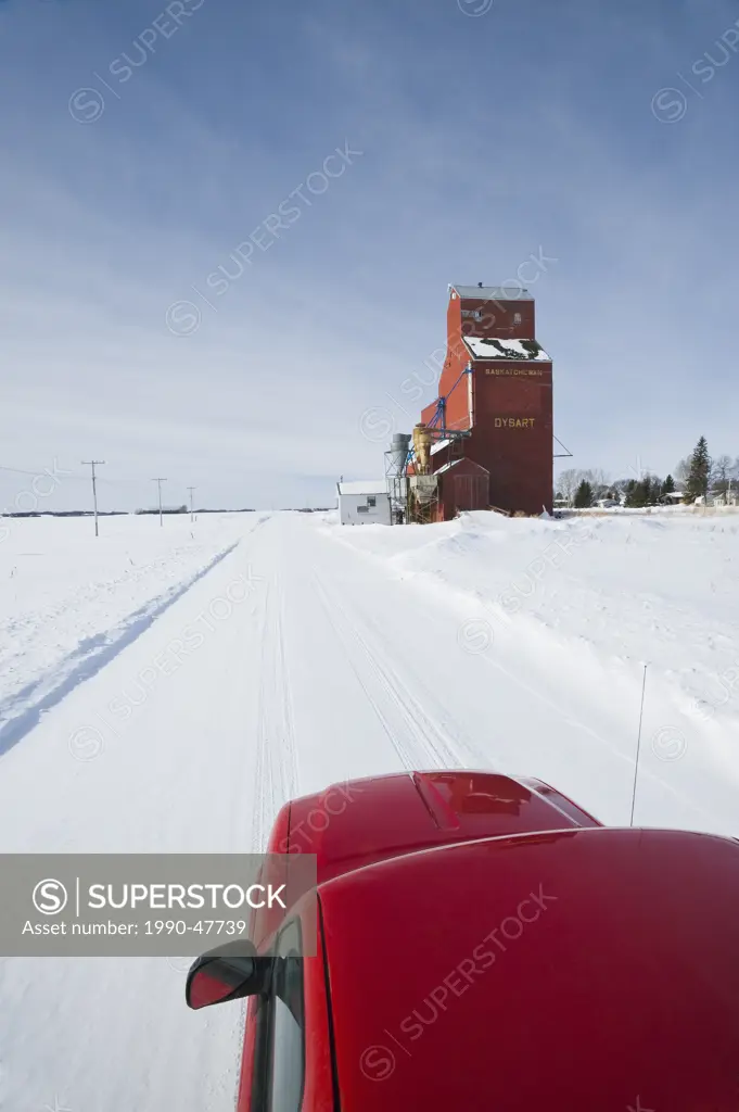 Pick up truck on road, old grain elevator, Dysart, Saskatchewan, Canada