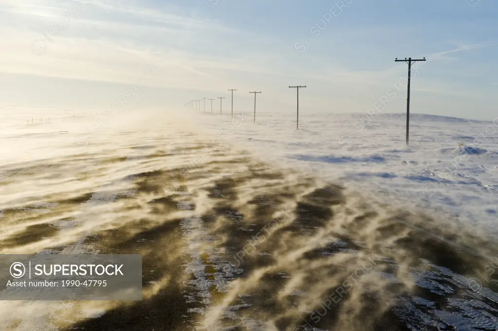 Road covered with blowing snow, near Verwood, Saskatchewan, Canada