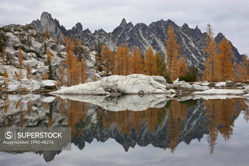 Golden Larches and Prusik Peak Reflected in Troll Sink Tarn, Upper Enchantments, Alpine Lakes Wilderness, Washington State, USA