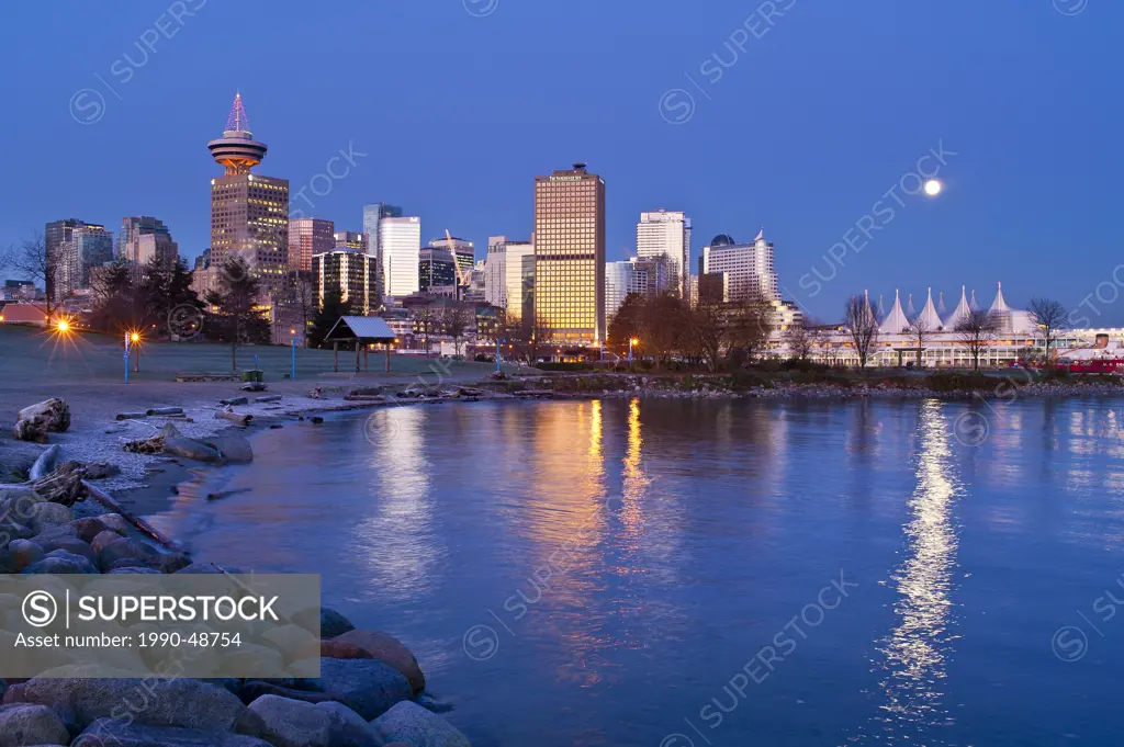 Full moon setting over Canada Place, Vancouver, British Columbia, Canada