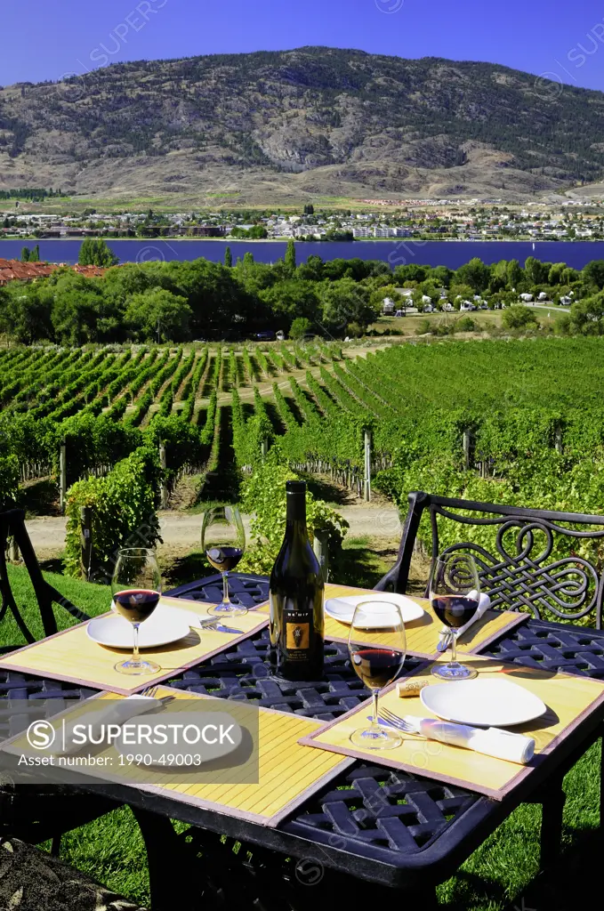 A table of four is set with wine on the patio at Nk´ Mip Cellars, Nk´Mip Desert Cultural Centre, Osoyoos, British Columbia, Canada
