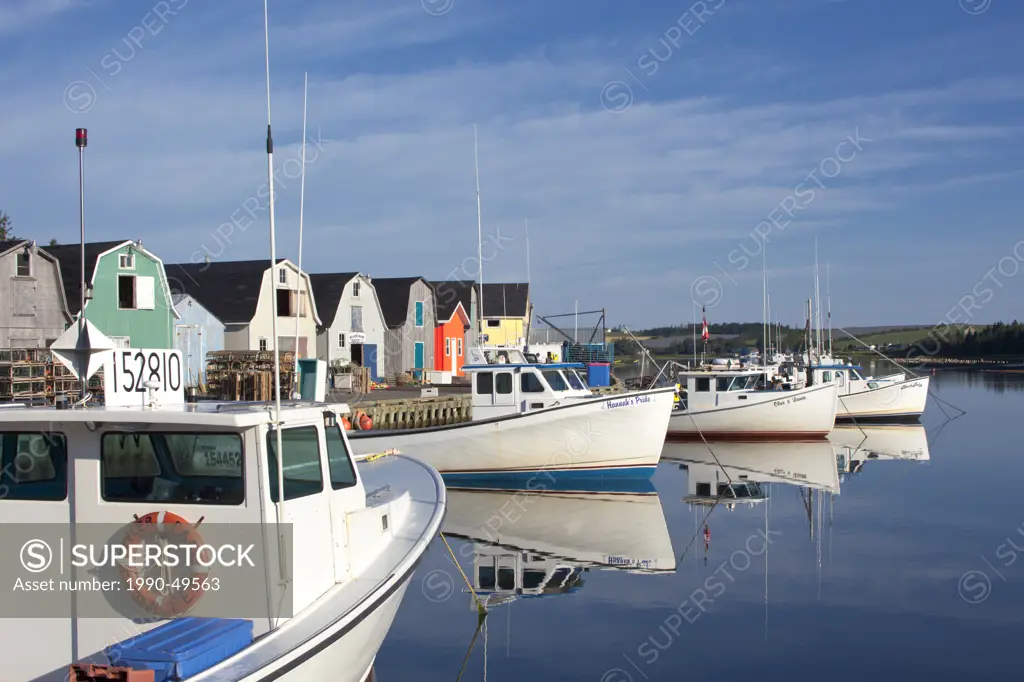 Fishing boats reflected in North Rustico Harbour, Prince Edward Island, Canada