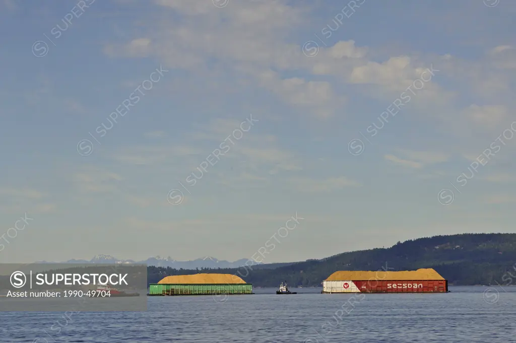 Barges with wood chips going to pulp mill at Crofton, Vancouver Island, British Columbia, Canada