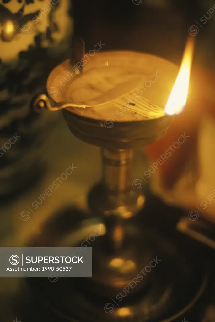A light burns in Man Mo Temple in Hong Kong, China