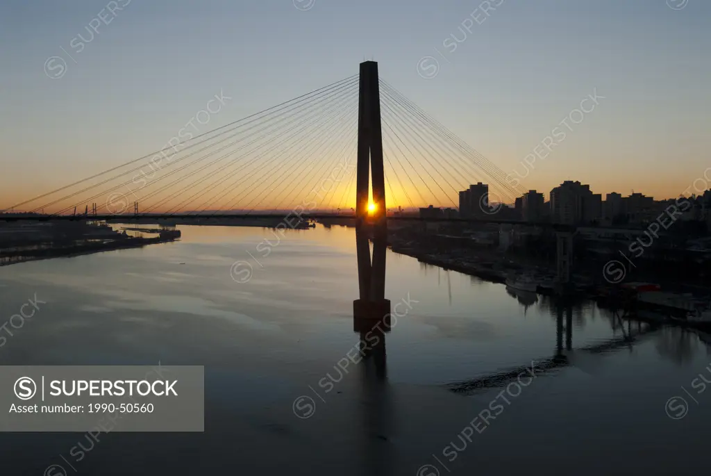 Sunset behind the Skytrain Bridge and the Fraser River in New Westminster, British Columbia, Canada.