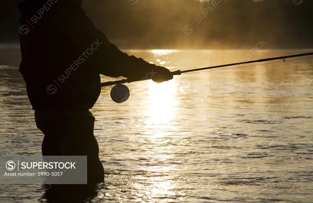 Flyfisherman at sunsrise, Bulkley river, Smithers, British Columbia, Canada