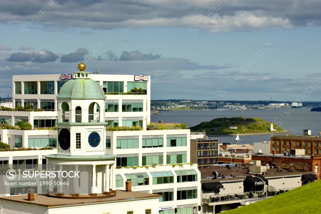 The Citadel fort clock tower in the foreground with Halifax Harbour in background, Nova Scotia, Canada