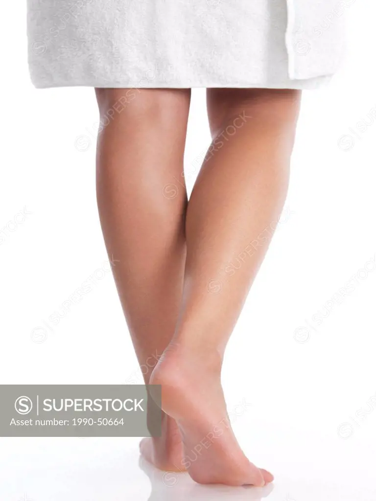 Closeup of legs of a young woman wrapped in a towel