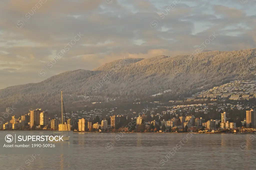 Sailboat in English Bay looking to West Vancouver and North Shore Mountains, Vancouver, British Columbia, Canada