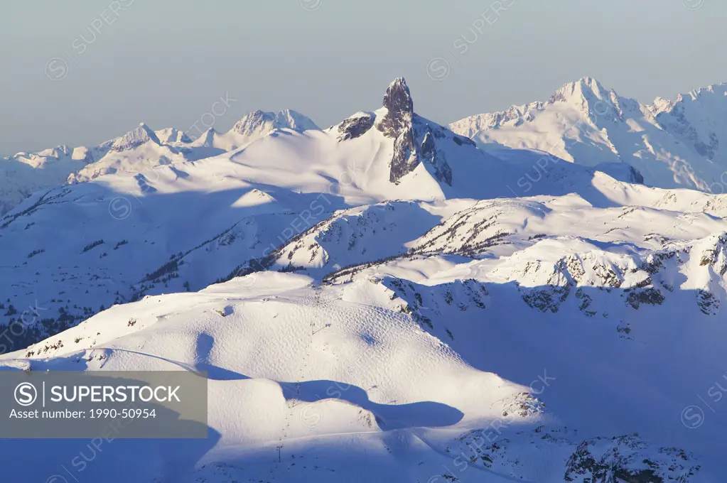 harmony express chairlift, harmony bowl with black tusk and tantalus range in background, british columbia, Canada.