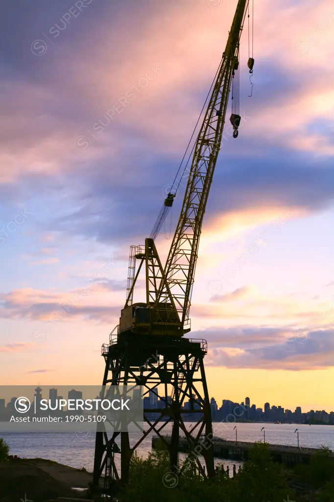 Ship cargo crane at sunset, Vancouver Harbour at Lonsdale Quay, North Vancouver, British Columbia, Canada