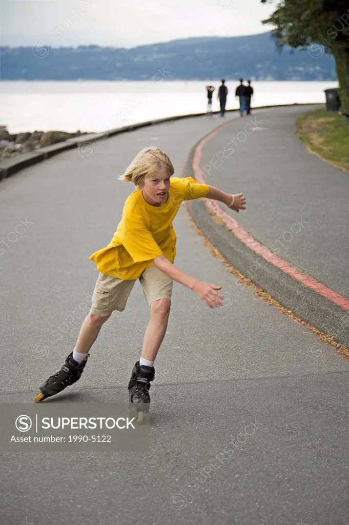 Boy rollerblading on Sea Wall in Stanley Park, Vancouver, British Columbia, Canada