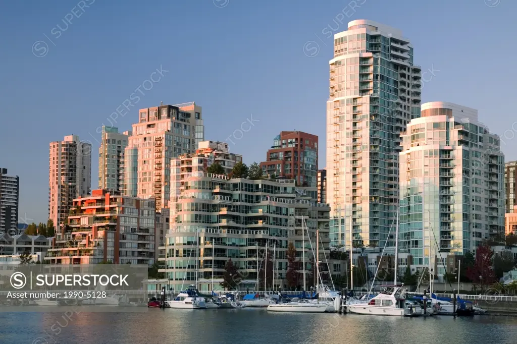 Boats docked in False Creek and downtown condominiums, Vancouver, British Columbia, Canada