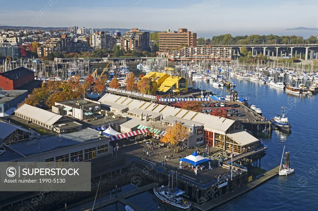 Granville Island Public Market with boats docked in False Creek and downtown, Vancouver, British Columbia, Canada