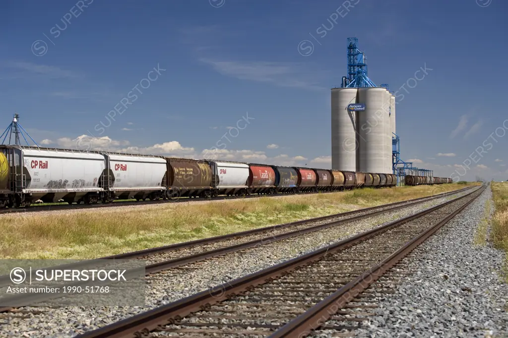 Grain elevator and railroad near Transcanada Highway, Alberta.
