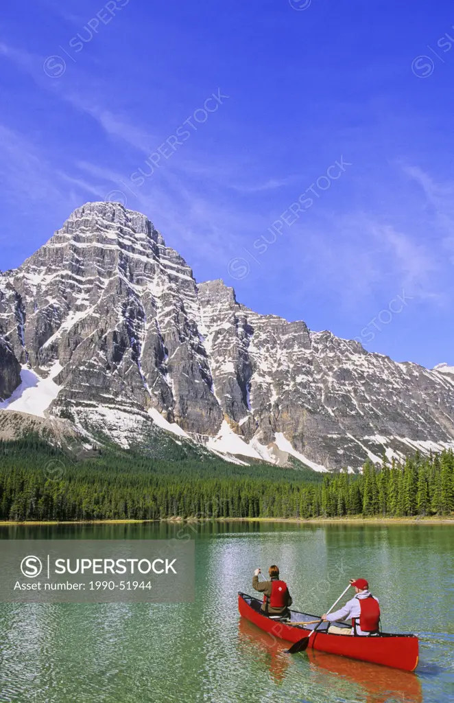 Canoeing on Upper Waterfowl Lake, Mount Chephren in the background, Banff National Park, Alberta, Canada.