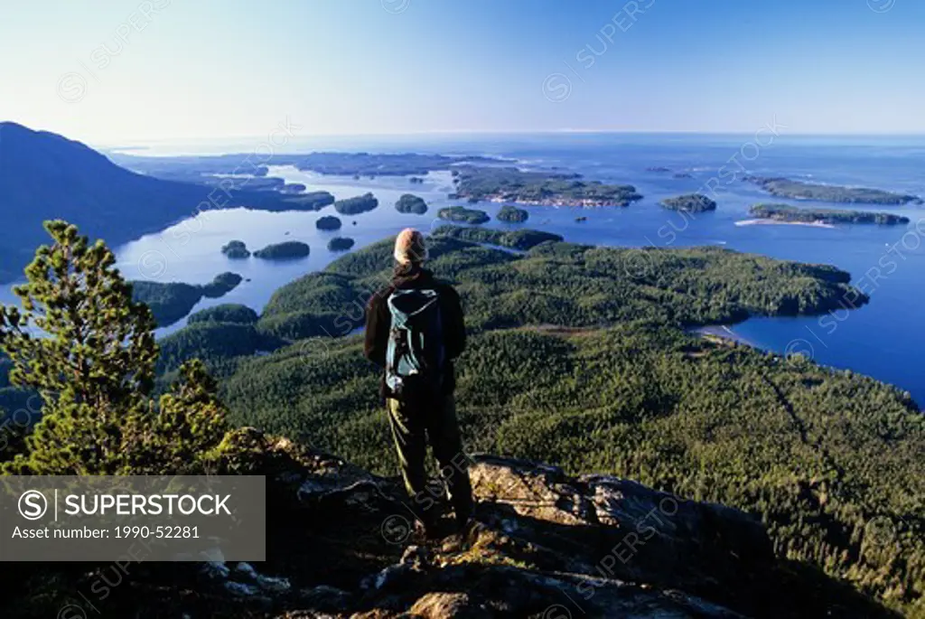 Hiker over looking Tofino and surrounding Clayoquot Sound, Vancouver Island, British Columbia, Canada.