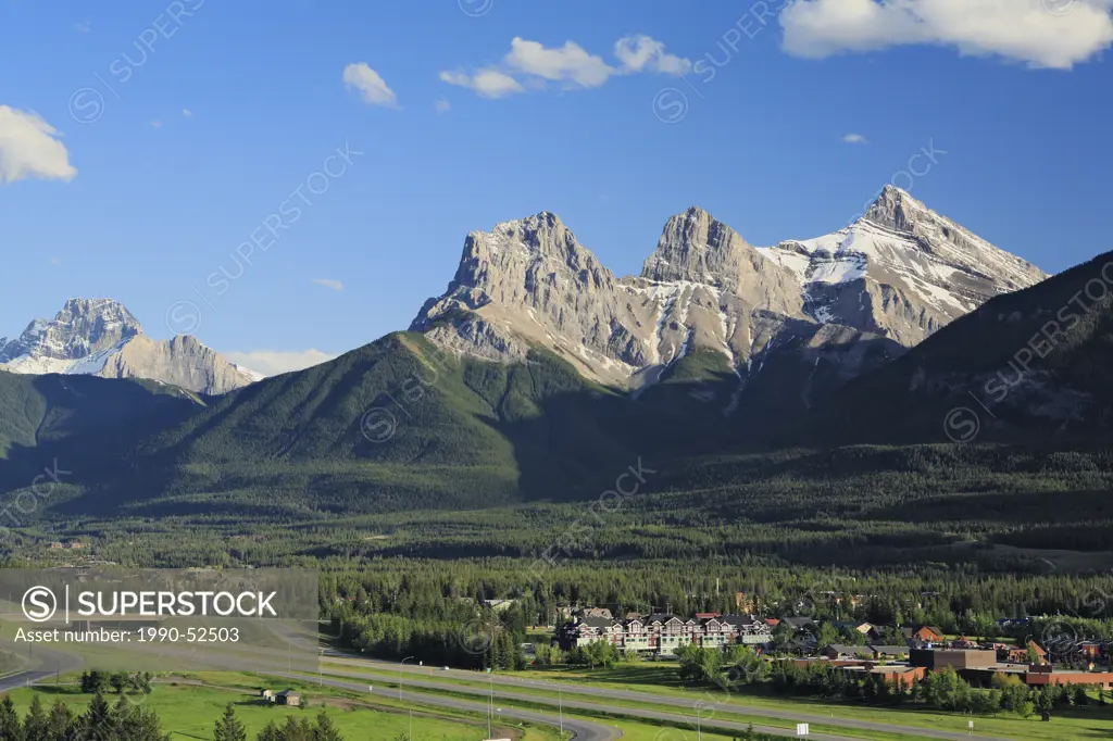 The Trans_Canada Highway runs through the Bow Valley and the town of Canmore beneath the Three Sisters mountains in Alberta, Canada