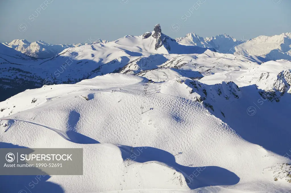 peak express chairlift, black tusk and tantalus range in background, british columbia, Canada.
