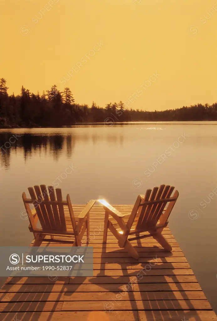 chairs on dock, Lyons Lake, Whiteshell Provincial Park, Manitoba, Canada.