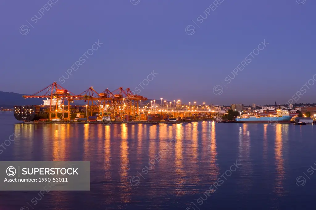 Port of Vancouver and freighter at dusk, British Columbia, Canada.