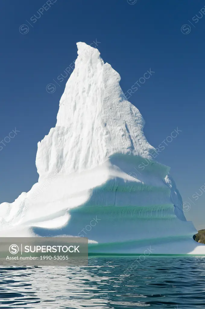 Iceberg floats in Trinity Bay off the Bonavista Peninsula of eastern Newfoundland, Newfoundland and Labrador, Canada.