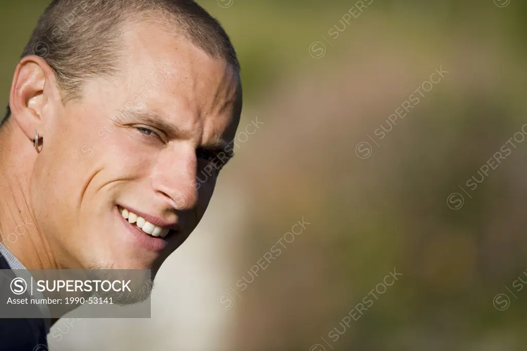Potrait of a smiling male, outdoors, Canada.