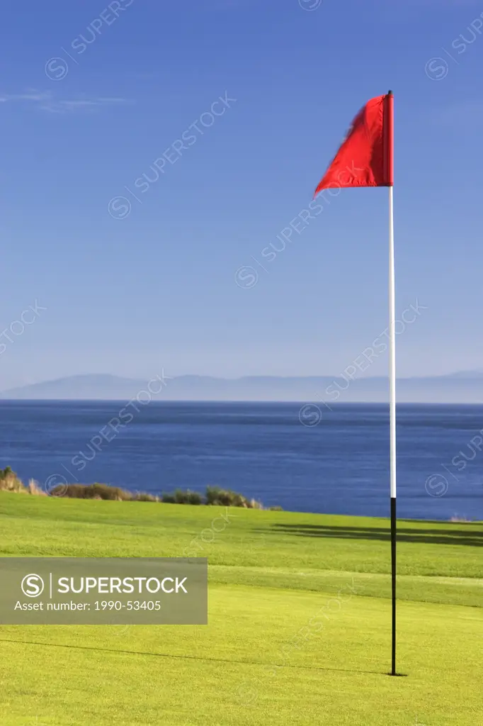 Golf green and Pacific Ocean, Victoria, British Columbia, Canada.