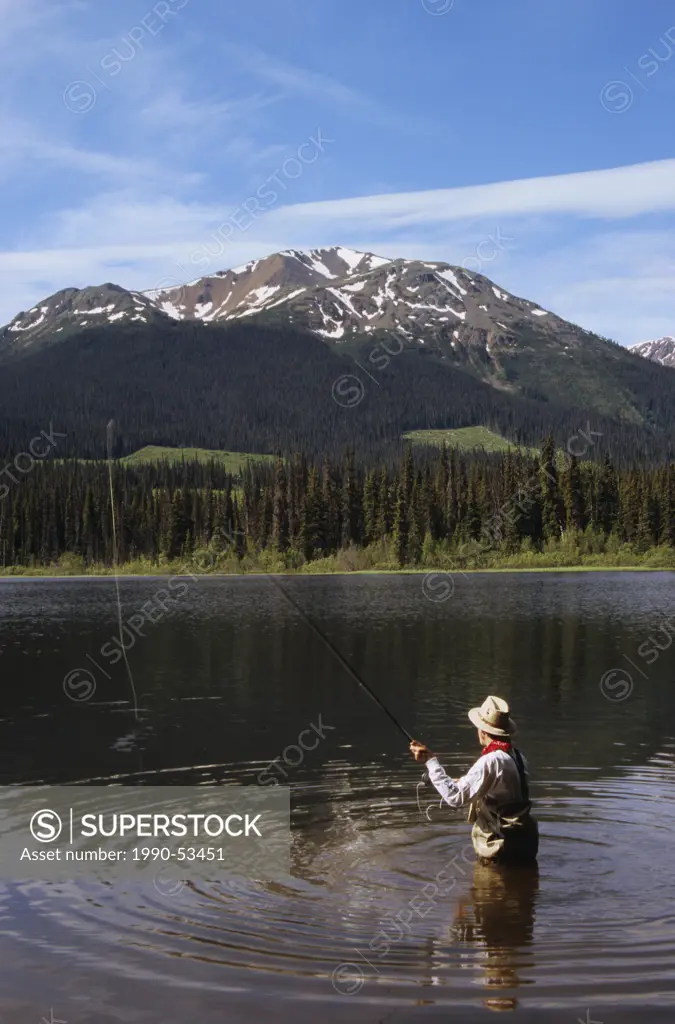 Flyfisherman on Dennis Lake, Bulkley Valley, British Columbia, Canada.