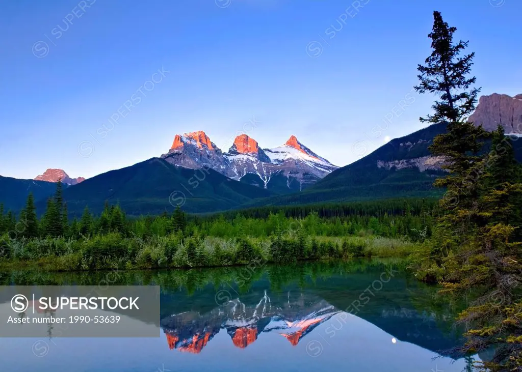 Three Sisters Mountain reflection in water, Canmore, Alberta, Canada