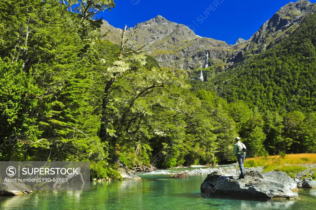 Man fly fishing, Routeburn River, South Island, New Zealand