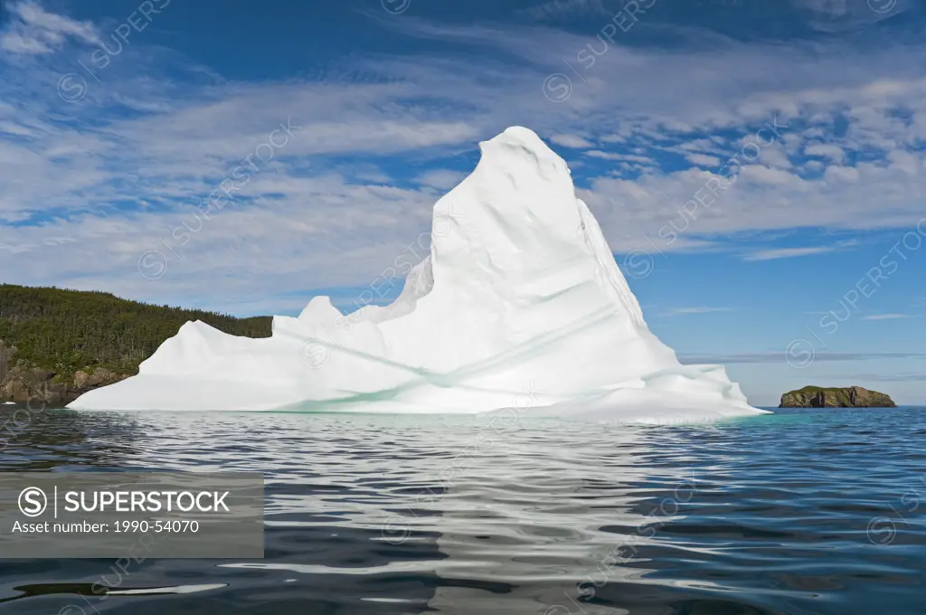Iceberg floats in Trinity Bay off the Bonavista Peninsula of eastern Newfoundland, Newfoundland and Labrador, Canada.